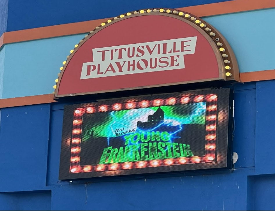 Titusville Playhouse marquee sign displaying an advertisement for the musical Young Frankenstein.